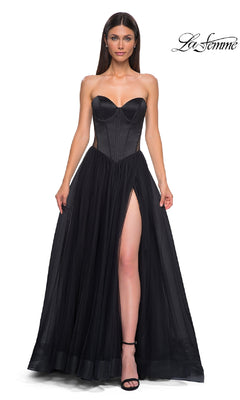 A woman wears the Black Strapless Long Prom Dress: La Femme 32771, featuring a sweetheart neckline, corset-style bodice, and high side slit, standing against a white background with the "La Femme" logo in the top right corner.