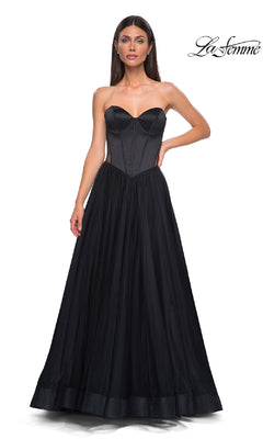 A woman stands against a white background wearing the La Femme 32771 Black Strapless Long Prom Dress, featuring a sweetheart neckline, corset-style bodice, and full tulle skirt. The "La Femme" logo appears in the top right corner.