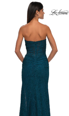 A woman with long hair is shown from the back wearing the teal Strapless Long Beaded Prom Dress: La Femme 32773, hands at her sides. The La Femme logo appears in the top right corner.
