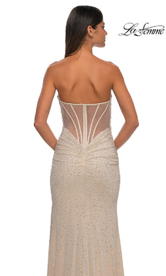 A woman faces away, wearing the Strapless Long Beaded Prom Dress: La Femme 32774, featuring sheer panels and sparkling embellishments. The "La Femme" logo is visible in the upper right corner.