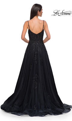 A woman is seen from the back wearing the La Femme 32781 long black glitter prom dress with thin straps, displayed against a white background. The La Femme logo appears in the top right corner.