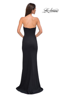 A woman models the Classic Strapless Long Prom Dress: La Femme 32784, photographed from the back against a white background with the "La Femme" logo in the corner.