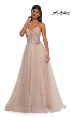 A woman models the La Femme 32789 Strapless Long Prom Ball Gown, featuring a sweetheart bodice with silver waist embellishment and a flowing blush pink tulle skirt, standing against a white background.