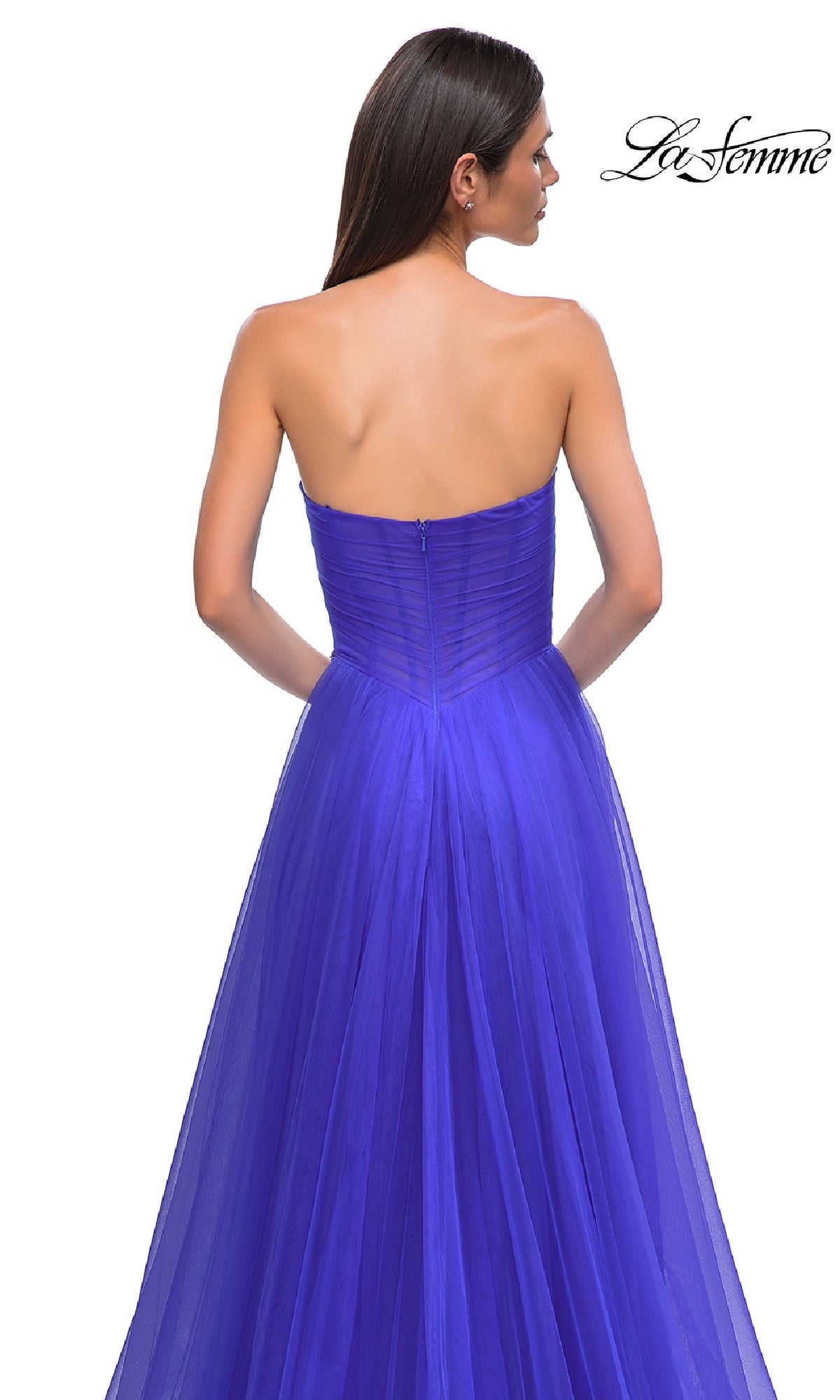 Woman wearing the Strapless Long Prom Ball Gown: La Femme 32789, with a fitted sweetheart bodice and flowing tulle skirt, shown from the back on a white background. La Femme logo appears in the top right corner.