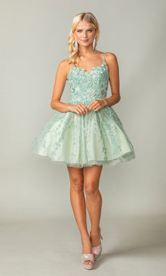 A woman models the Embroidered Babydoll Short Glitter Prom Dress in light green, featuring floral embroidery, a sleeveless design, and a tulle skirt, standing against a plain background.
