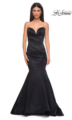 Woman models the Strapless Long Mermaid Prom Dress (La Femme 32791) in black, featuring a fitted silhouette and sweetheart neckline; La Femme logo appears in the top right corner.