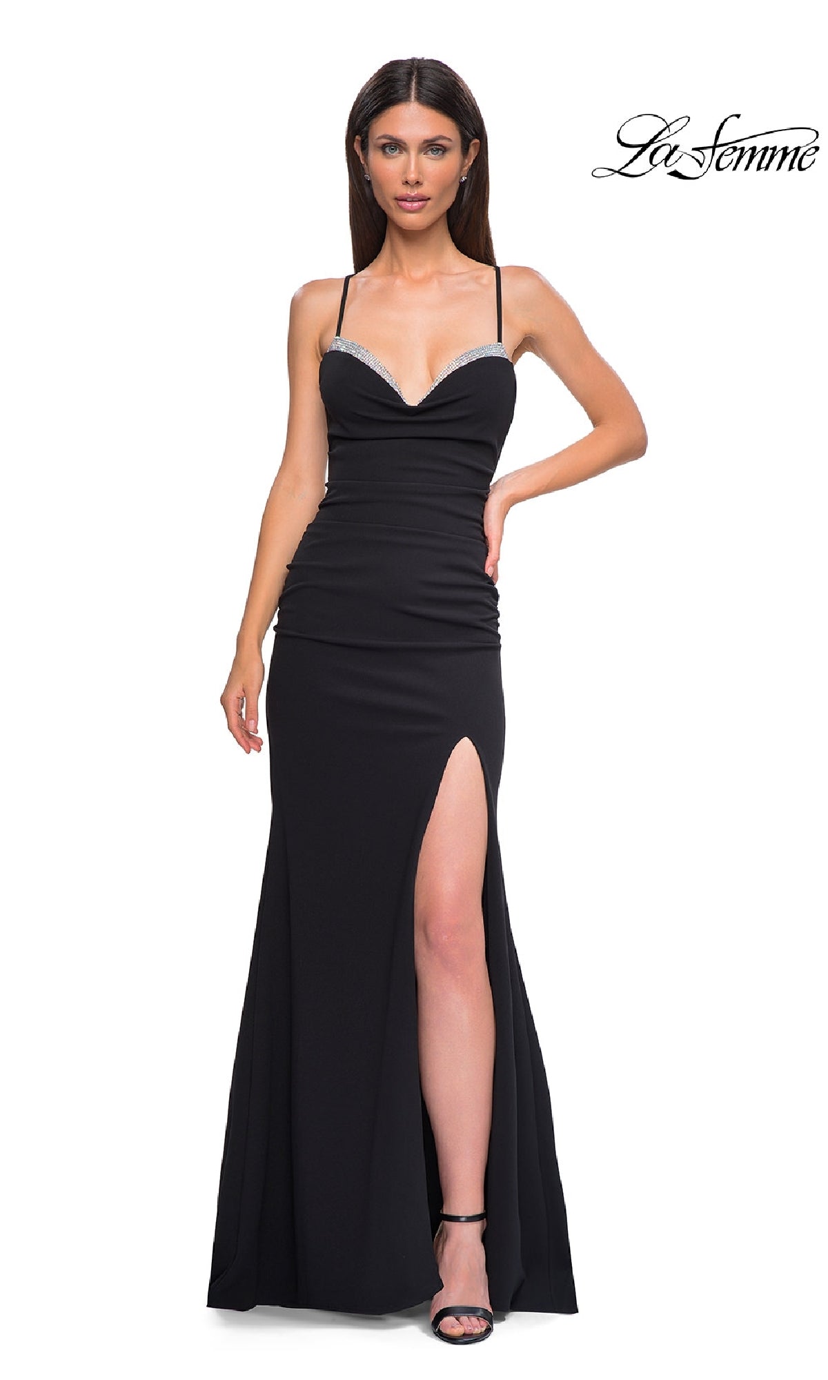 Woman models the black Lace-Up Open-Back Long Prom Dress (La Femme 32802) featuring thin straps, sweetheart neckline, thigh-high slit, and open back, posing against a white background with the La Femme logo in the top right.