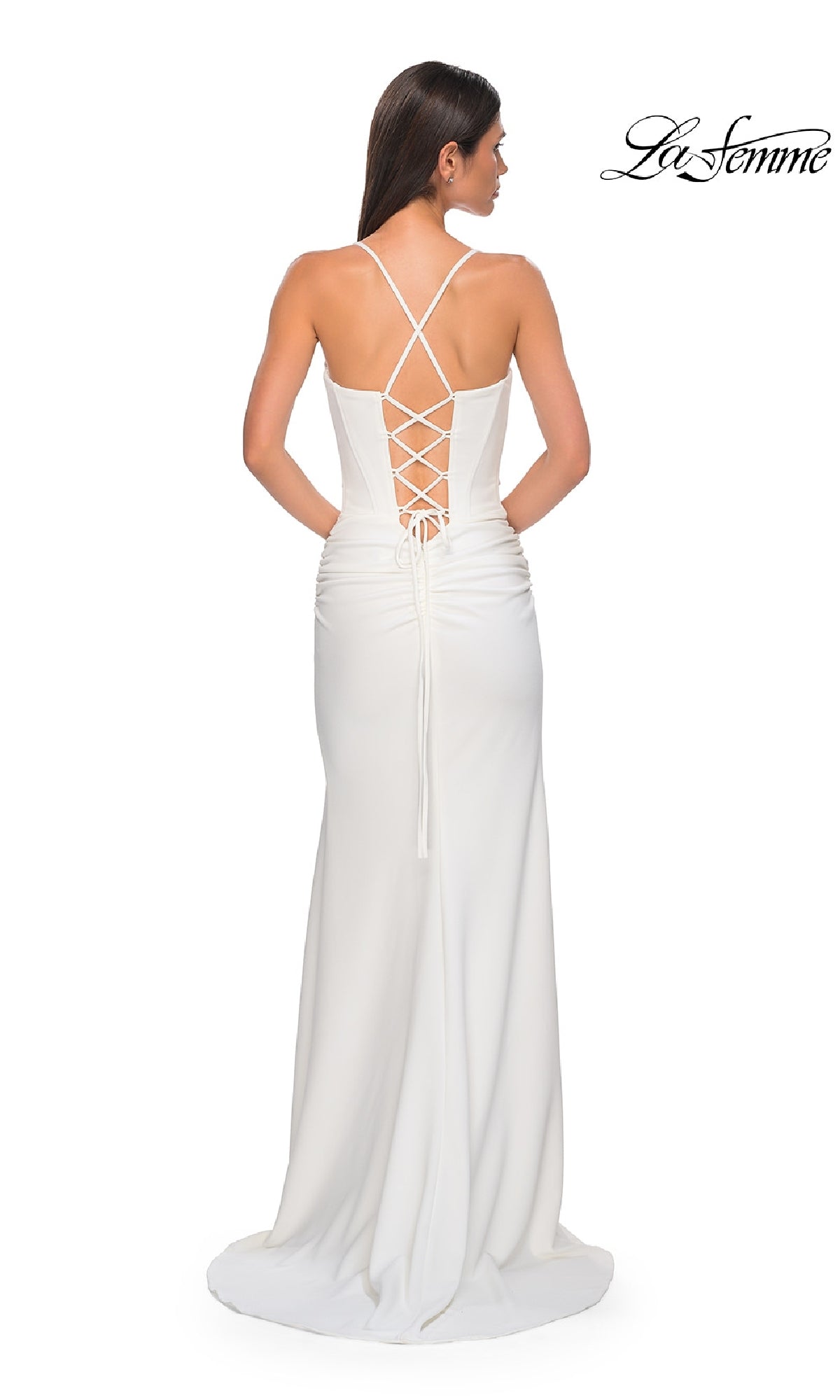 A woman wears the La Femme 32802 lace-up open-back long prom dress, featuring a white fitted silhouette, thin straps, crisscross lace-up back, and slight train for an effortlessly elegant look.