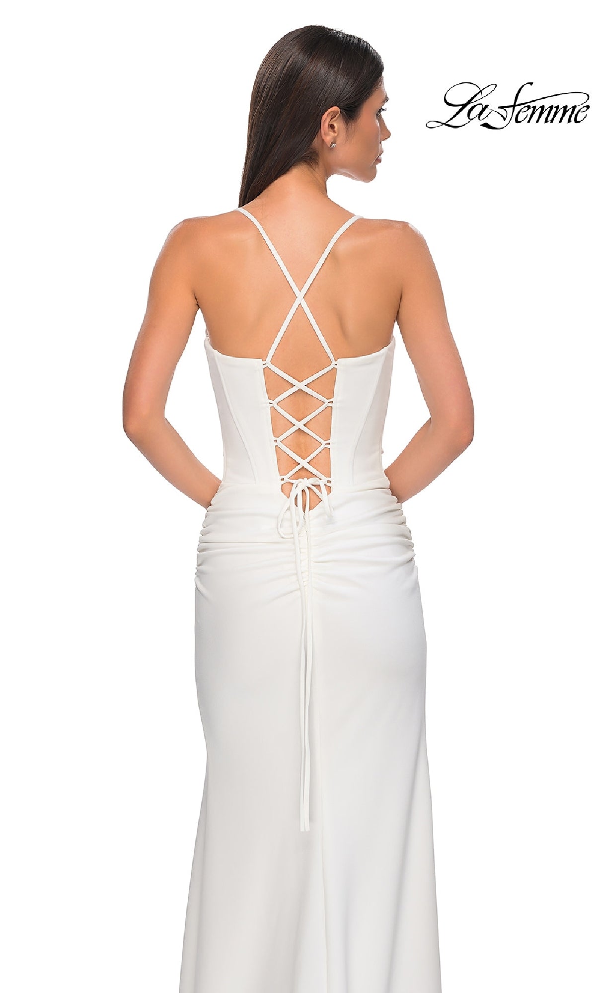 Woman in a white Lace-Up Open-Back Long Prom Dress (La Femme 32802) with crisscross lace-up detailing, standing and facing away; 