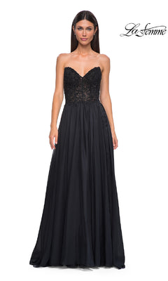 A woman stands against a white background wearing the La Femme 32804, a strapless long A-line prom dress featuring a beaded lace bodice and flowing skirt.
