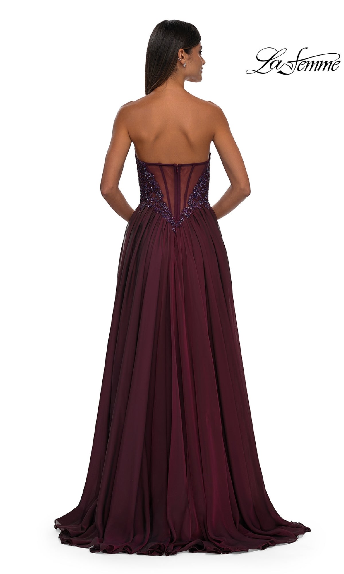 A woman faces away from the camera in the La Femme 32804, a strapless long A-line prom dress with an embellished fitted bodice and flowing floor-length skirt. The La Femme logo appears in the top right corner.