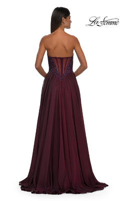 A woman faces away from the camera in the La Femme 32804, a strapless long A-line prom dress with an embellished fitted bodice and flowing floor-length skirt. The La Femme logo appears in the top right corner.