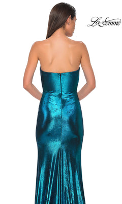 A woman models the Strapless Long Metallic Prom Dress La Femme 32828 in shiny teal, featuring a fitted bodice and flared skirt, shown from the back. The La Femme logo is displayed in the top right corner.
