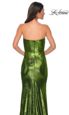 A woman models the Strapless Long Metallic Prom Dress: La Femme 32828, facing away to showcase the gown's intricate back details against a plain white background.