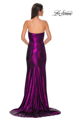 A woman in a strapless long metallic prom dress, style La Femme 32828, stands facing away and showcases the shimmering floor-length gown. The La Femme logo appears in the top right corner.