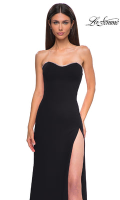 Woman in the Lace-Up Strapless Long Prom Dress (La Femme 32829) featuring a thigh-high slit and subtle beaded trim along the neckline; La Femme prom dress logo appears in the top right corner.