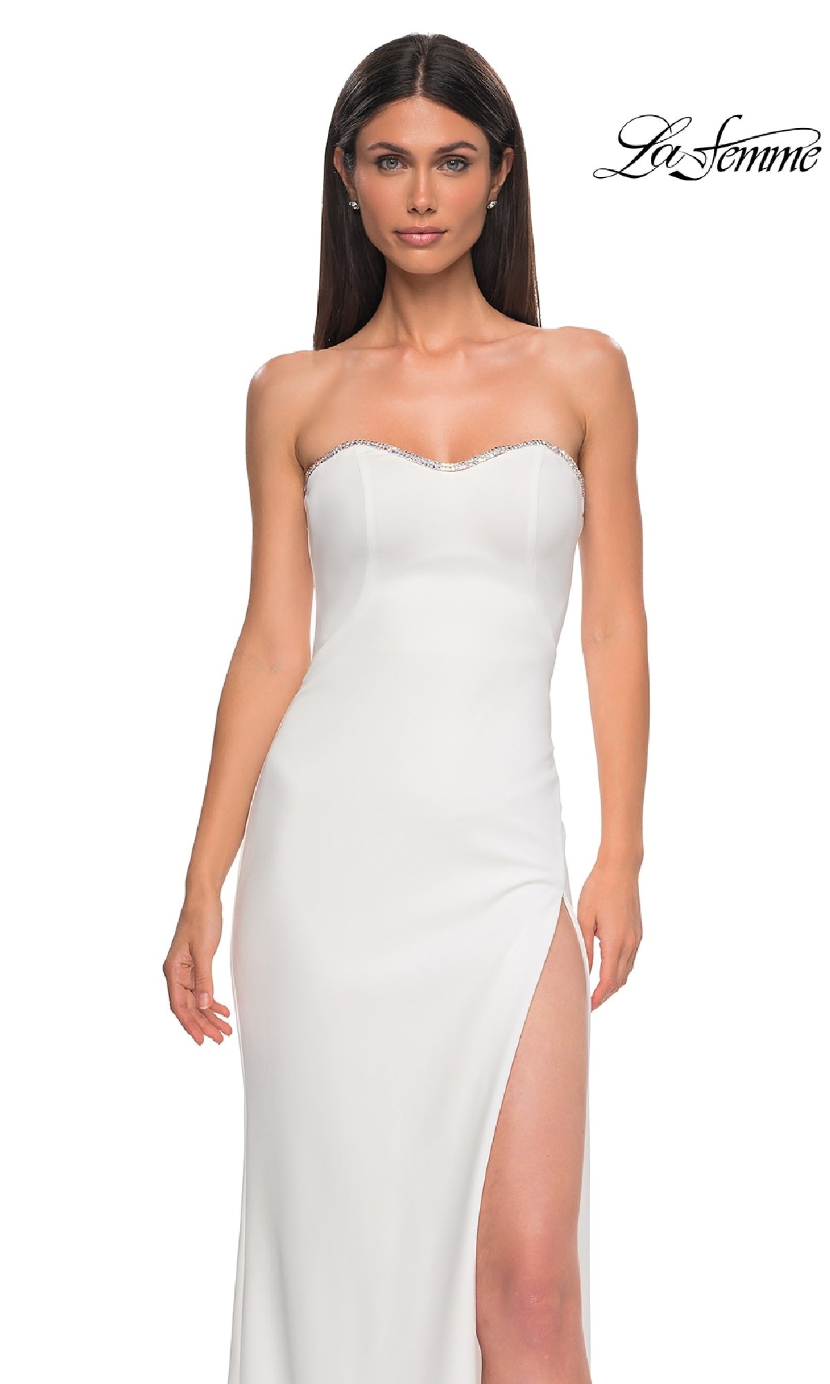 A woman wears the Lace-Up Strapless Long Prom Dress: La Femme 32829, featuring a thigh-high slit and beaded neckline trim, standing against a plain white background.