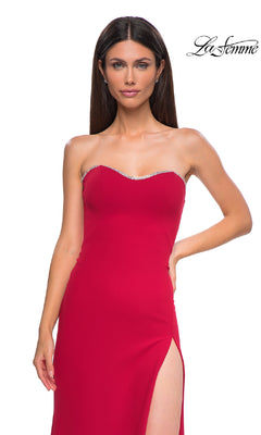 A woman wears the La Femme 32829 Lace-Up Strapless Long Prom Dress with a high slit and silver beaded trim, standing against a white background featuring the "La Femme" logo in the top right corner.