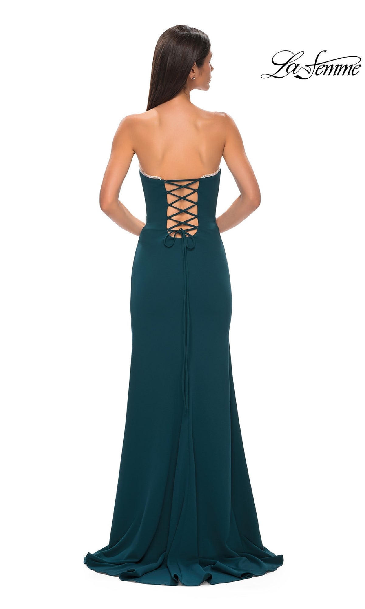 Woman wearing the Lace-Up Strapless Long Prom Dress: La Femme 32829, showing off its lace-up back. This dress features a fitted bodice and flowing skirt—ideal for making a statement at prom or any formal event.