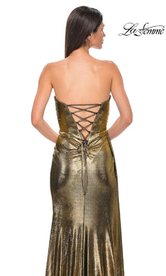 A woman models the Strapless Long Metallic Prom Dress: La Femme 32830, featuring a lace-up back, against a white background. The "La Femme" logo is shown in the top right corner.