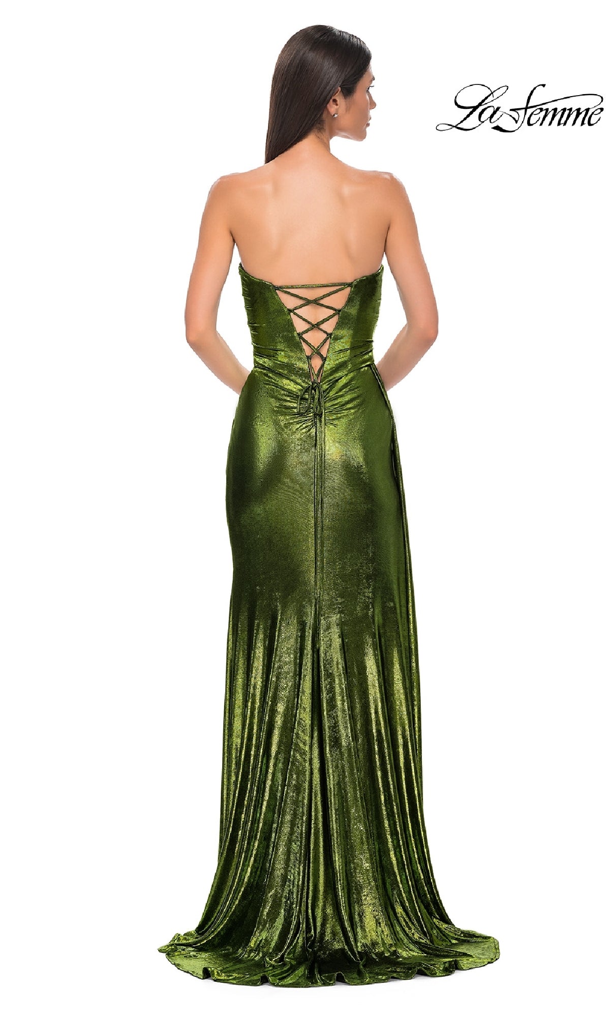 Woman wearing the Strapless Long Metallic Prom Dress: La Femme 32830 in green velvet, featuring a lace-up back; she stands facing away from the camera in this floor-length, waist-fitted gown.
