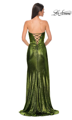 Woman wearing the Strapless Long Metallic Prom Dress: La Femme 32830 in green velvet, featuring a lace-up back; she stands facing away from the camera in this floor-length, waist-fitted gown.