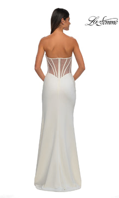 A woman poses against a plain white background in the Asymmetrical Strapless Prom Gown, La Femme 32849, featuring a sheer boned corset back. The "La Femme" logo appears in the top right corner.