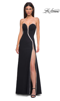 A woman poses against a white background with the "La Femme" logo, wearing the Strapless Long Jersey Prom Dress: La Femme 32854, featuring a high front slit and silver trim.