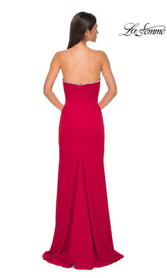 A woman is seen from the back wearing the Strapless Long Jersey Prom Dress: La Femme 32854, a floor-length red gown, against a white background with the "La Femme" logo in the top right corner.