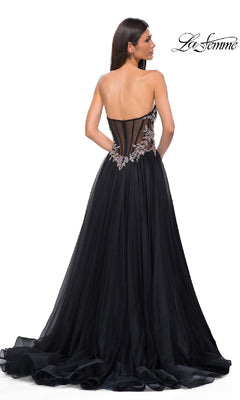 A woman is seen from the back wearing the Beaded-Corset Strapless Prom Gown: La Femme 32862, featuring a beaded corset bodice and flowing tulle a-line skirt. The "La Femme" logo appears in the top right corner.