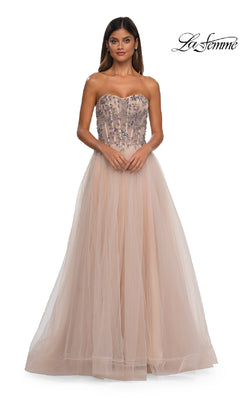 A woman models the Beaded-Corset Strapless Prom Gown: La Femme 32862, featuring a long light beige a-line tulle skirt and beaded corset bodice, against a white background with the "La Femme" logo in the top right.