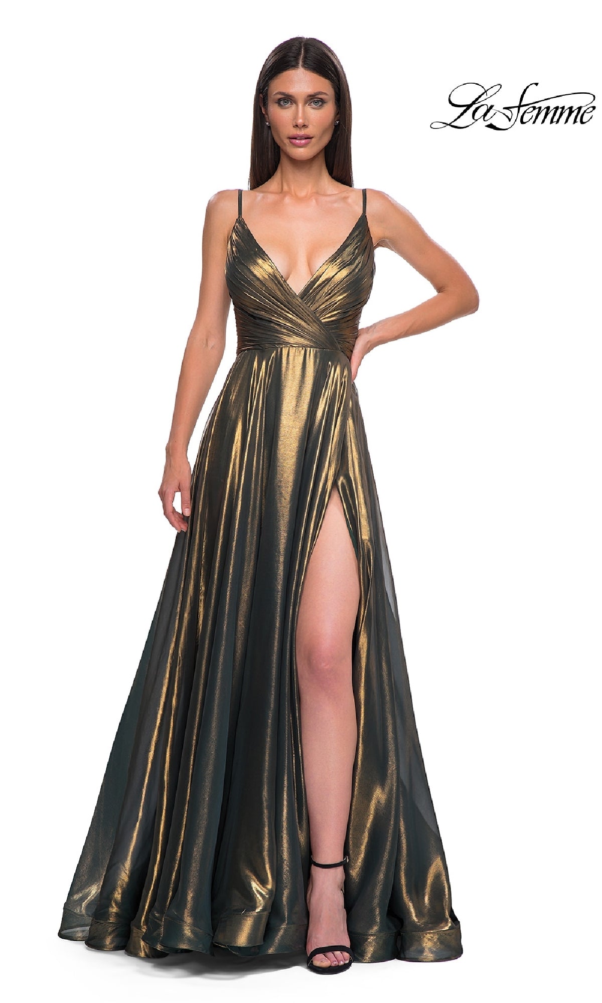 A woman models the La Femme 32864 Long Metallic Chiffon Prom Dress, featuring spaghetti straps, a deep V-neckline, and a high thigh slit. This gold A-line evening gown exudes elegance and sophistication against a white background.