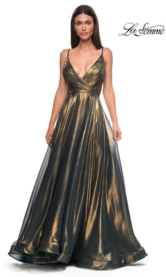 A woman models the La Femme 32864 Long Metallic Chiffon Prom Dress—a gold A-line gown with a deep V-neckline and flowing metallic skirt—standing before a plain white background.