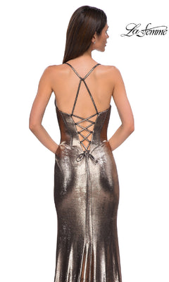 A woman is shown from behind wearing the Lace-Up Long Metallic Prom Dress: La Femme 32877, featuring thin straps and a lace-up back. The "La Femme" logo appears in the top right corner.