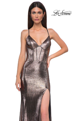 Model in a metallic Lace-Up Long Prom Dress (La Femme 32877) with thin straps and thigh-high slit, posing with one hand on hip against a white background. "La Femme" logo appears in the top right, highlighting this designer look.