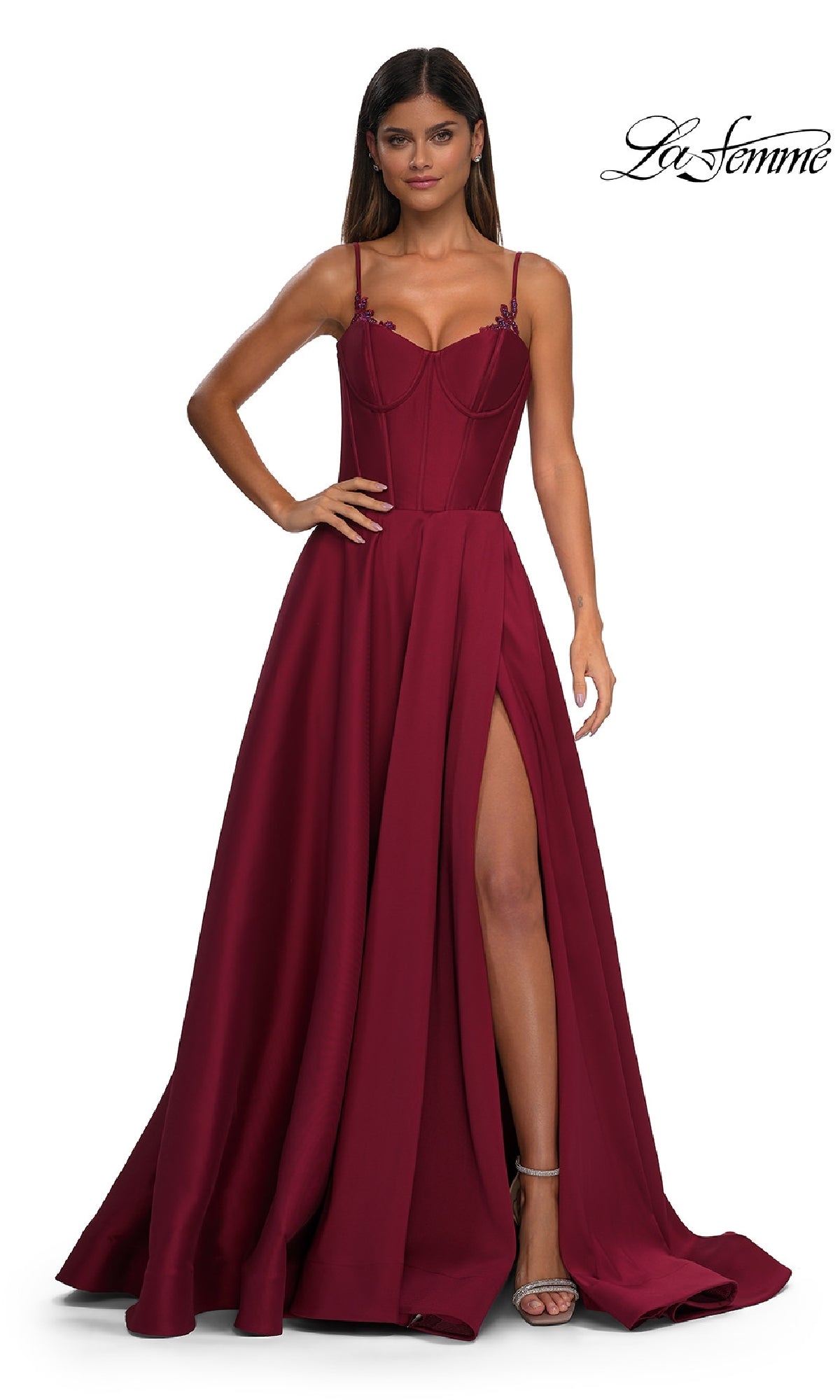 A woman stands in heels against a white background, wearing the La Femme 32878 Lace-Up Long Mikado Prom Dress with a fitted bodice and high slit. The 