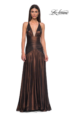 A woman wears the Long Prom Dress: La Femme 32887—a floor-length metallic gown with a deep V-neckline, fitted waist, open back, and flowing skirt. The "La Femme" logo appears in the top right corner.