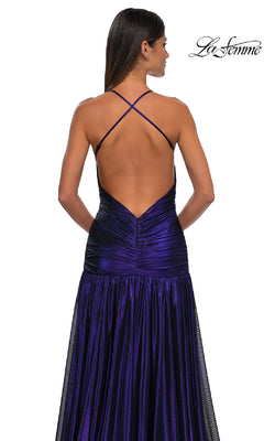 A woman is seen from behind wearing the La Femme 32887 long prom dress in deep purple, featuring a deep V-neckline, crisscross straps, an open back, ruched detailing, and a flowing skirt.