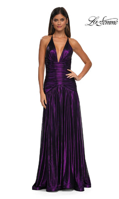 Woman in La Femme 32887: a sleeveless, deep violet metallic prom dress with deep V-neckline, gathered waist, open back, and full-length skirt. La Femme logo in top right corner.