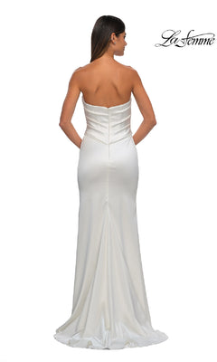 A woman is shown from the back wearing the La Femme 32896 Strapless Sweetheart Prom Gown, a fitted long white satin dress with a slight train, set against a plain white background.