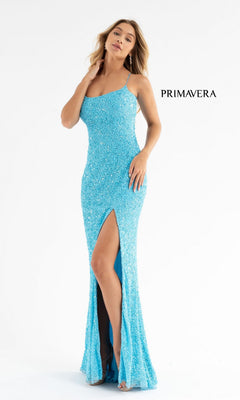 A woman models the Open Back Bold Long Sequin Prom Dress 3290D in fitted light blue with spaghetti straps, open back, and thigh-high slit against a white backdrop. The word "PRIMAVERA" appears beside her.