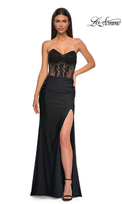 A woman models the La Femme 32912 Sheer-Waist Long Corset Prom Dress, featuring a beaded lace bodice and high slit, against a white background. The La Femme logo appears in the top right corner.