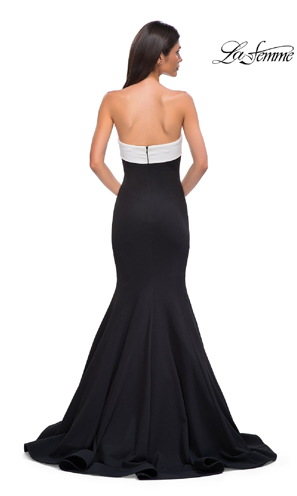 A woman models the La Femme 32914 strapless long black prom dress, facing away to display its fitted bodice and flared mermaid skirt. The 