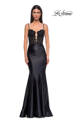 A woman wears the La Femme 32916 black mermaid prom dress, featuring an illusion lace bodice, thin straps, and a sleek satin skirt. The La Femme logo is displayed in the top right corner.
