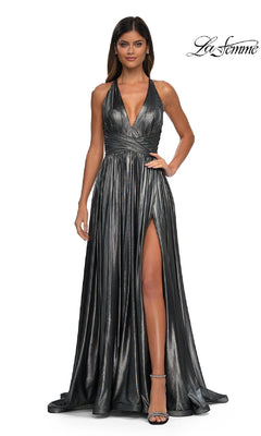 A woman models the La Femme 32917 V-Neck Long Metallic Prom Dress, featuring a halter neck, deep V neckline, and thigh-high slit, standing against a white background to highlight the gown's glamorous style.