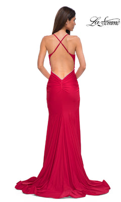 A woman faces away, wearing the Elegant Long Mermaid Prom Dress: La Femme 32918—a floor-length, open-back gown with crisscross straps, a fitted mermaid silhouette, and slight train. "La Femme" logo is in the top right corner.