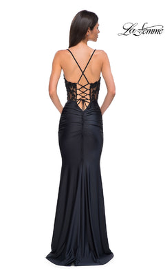 Woman wearing the Beaded-Bodice Long Prom Dress: La Femme 32920— a fitted black satin gown with spaghetti straps, lace-up back, and beaded corset detail—stands with her back to the camera.