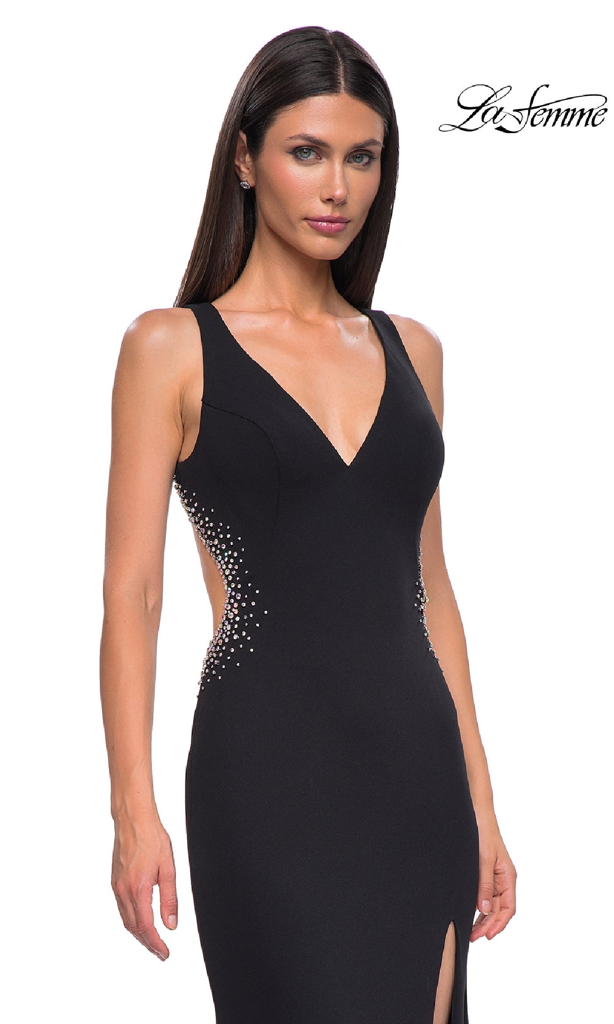 La Femme 32922: A woman models a sleeveless black jersey long prom dress with a deep V-neckline, side cutouts, pearl embellishments, and an open back; “La Femme” logo appears in the top right corner.