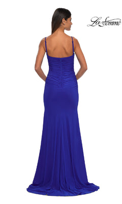 A woman faces away, wearing the La Femme 32925 Classic Long Sweetheart Prom Dress—floor-length, fitted, royal blue with thin straps and a slight train. The La Femme logo is in the top right corner.