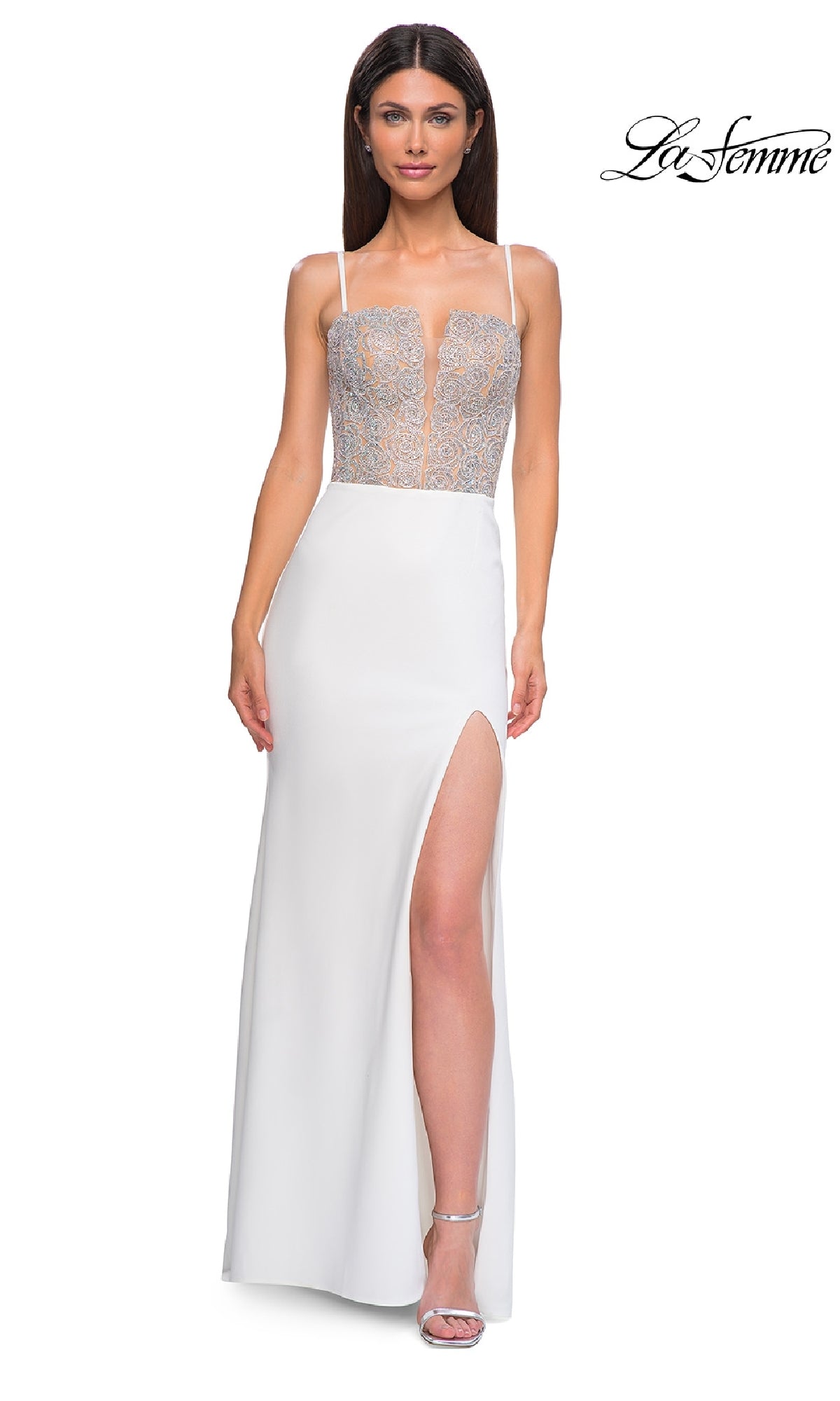 A woman models the Beaded-Corset Long Prom Dress (La Femme 32930), featuring a white jersey fabric, sheer embroidered deep v-neck bodice, and high slit, against a plain white background. 